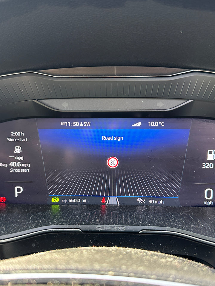 Digital instrument cluster with SUPERB lettering below it, showing a “Road sign” screen with a 30 speed-limit sign