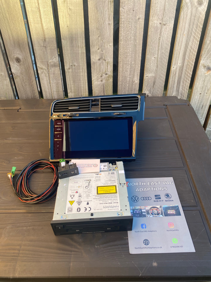 Wide-screen dash panel with vents, a head unit with SD1 and SD2 slots, a wiring loom with USB socket and a leaflet